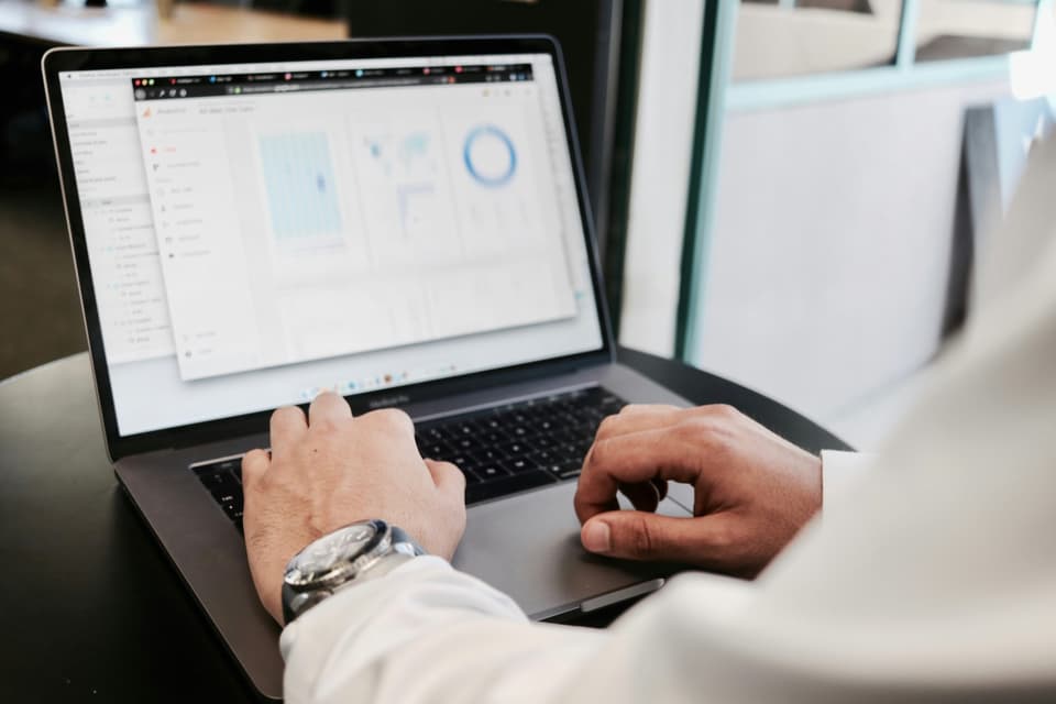 Professional reviewing data and debt portfolios on Debexpert