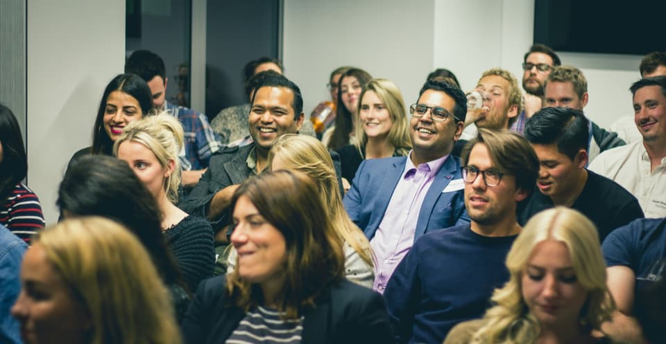 Audience seated at a professional seminar or workshop