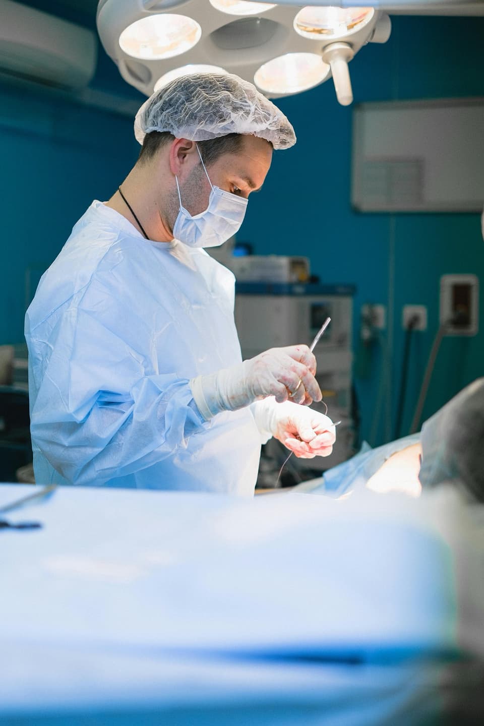 Surgeon in an operating room — healthcare context for medical receivables