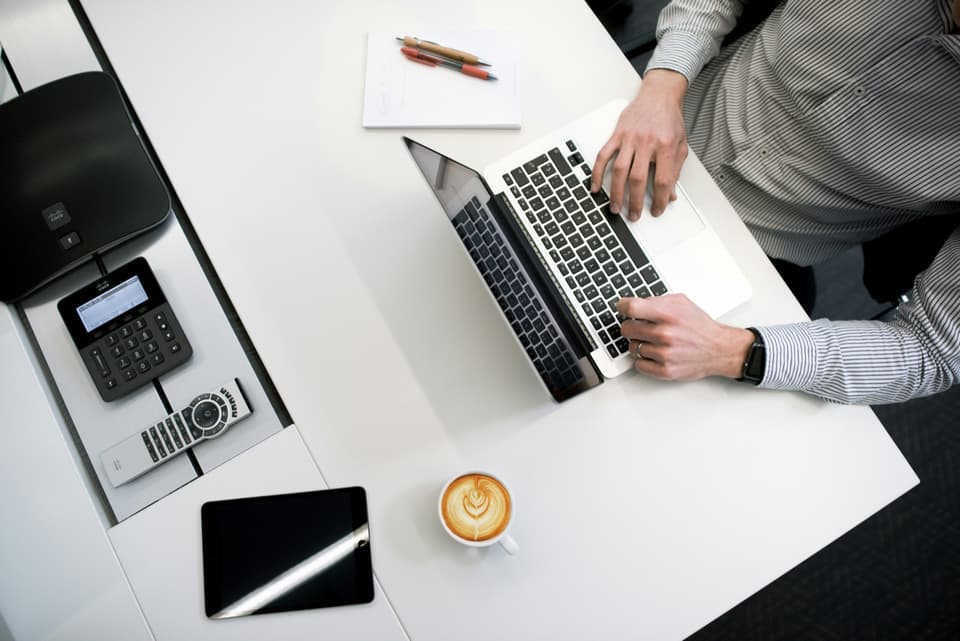 Financial review with laptop and analytics — maximizing mortgage note value