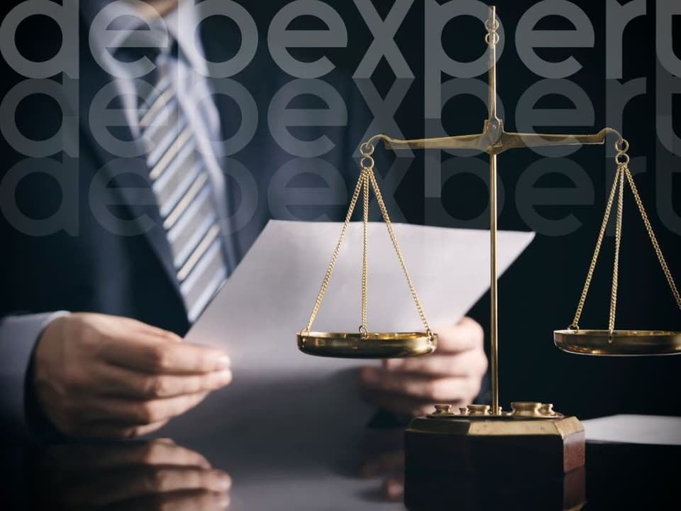 65168f615fd34e11faafdd34_A-man-looks-at-the-judicial-documents.jpg